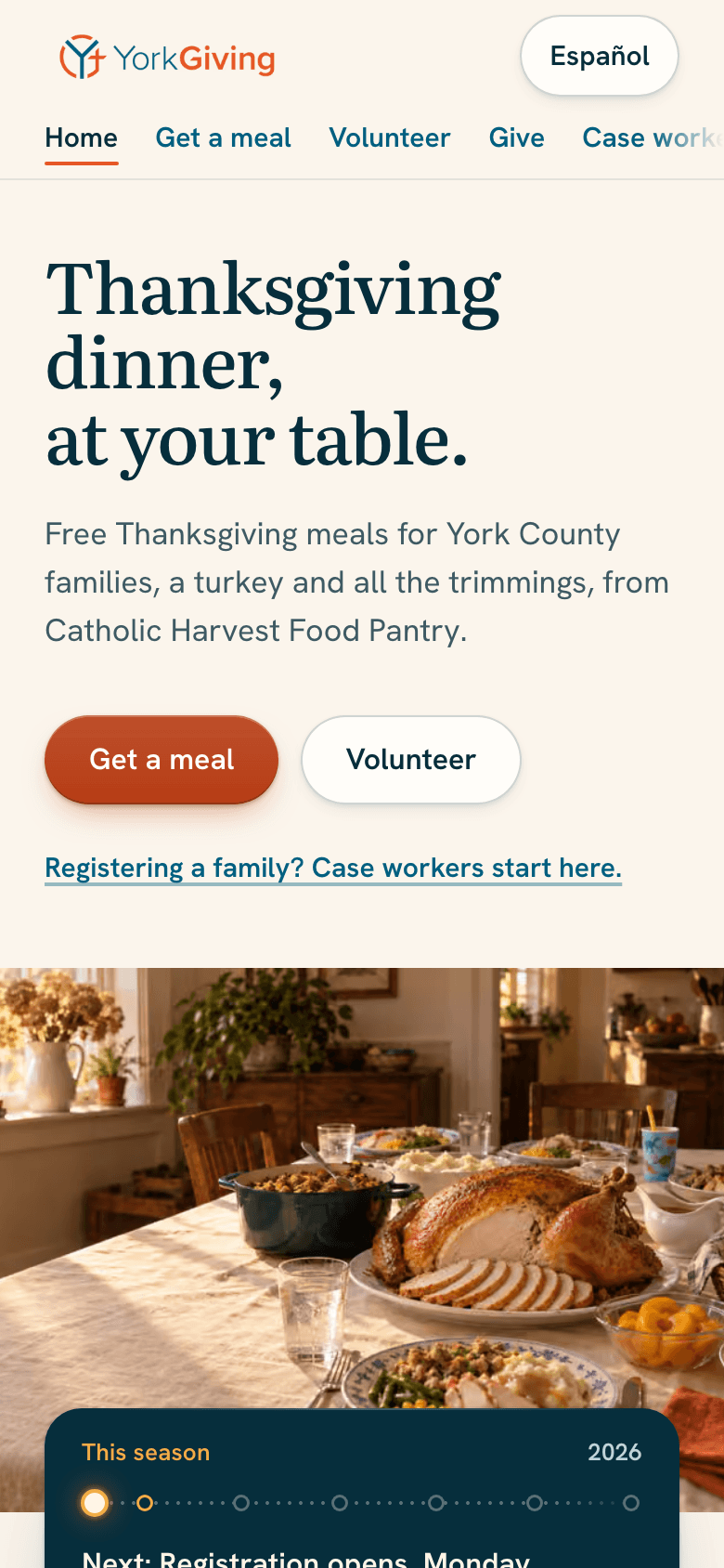 The top of the yorkgiving.com homepage: the headline, a line on the meal and who provides it, buttons to get a meal or to volunteer, and a picture of a Thanksgiving table.
